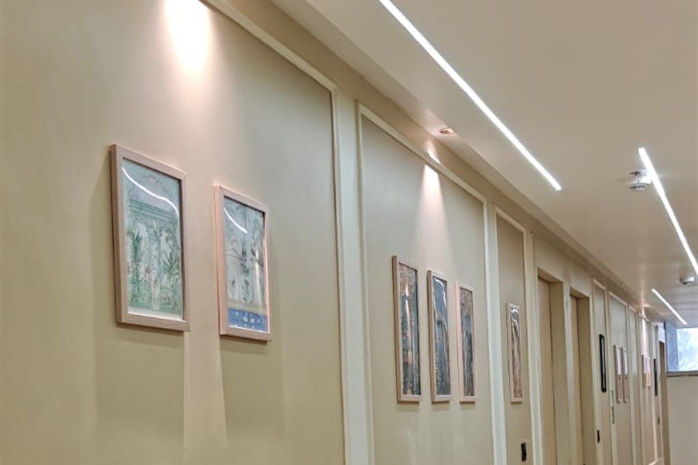 Illuminated Carpeted Guest Corridor - Comfort Stay Kanpur